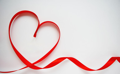 Red heart ribbon bow isolated on white background. Valentines day concept