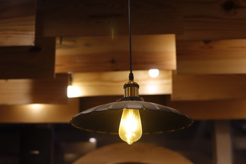 Yellow light hanging on ceiling	