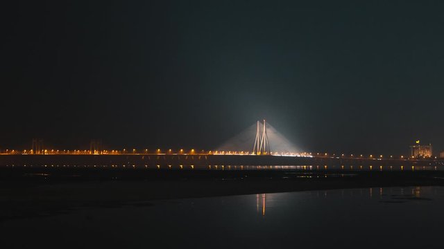 Timelapse of cars passing over the sealink at night