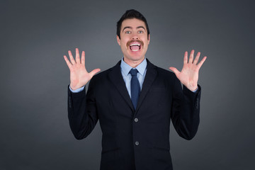 People, success, winning, victory, excitement, goals, determination and achievement concept. Joyful excited lucky man cheering, celebrating success, screaming yes with clenched fists