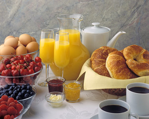 Brunch Ingredients, jam, marmalade, coffee, croissant, eggs, cherries, blueberries, raspberries, butter, orange juice