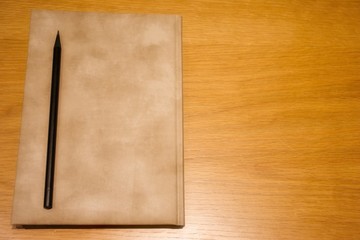 Notepad with the pen on the desk