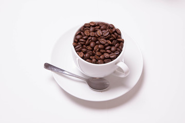White Cup Full of Coffee Beans