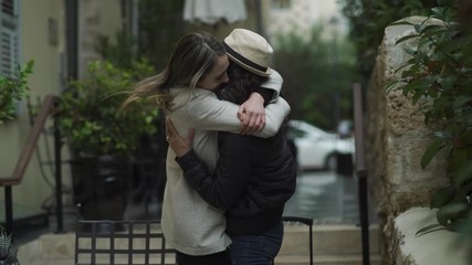 Two best girlfriends hugging and saying goodbye and farewell before a seperation. 4K