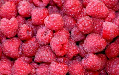 Natural background of sweet raspberry. Fresh and ripe red berries, closeup photo. Healthy, delicious dessert.