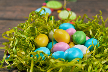 Fototapeta na wymiar Colorful easter eggs in green nest.