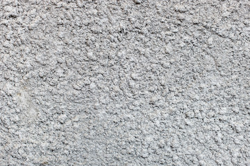 gray natural decorative plaster cement-based exterior wall. texture of the old wall. monochrome. selective focus