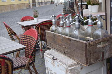 Old wooden box with glass bottles for siphon