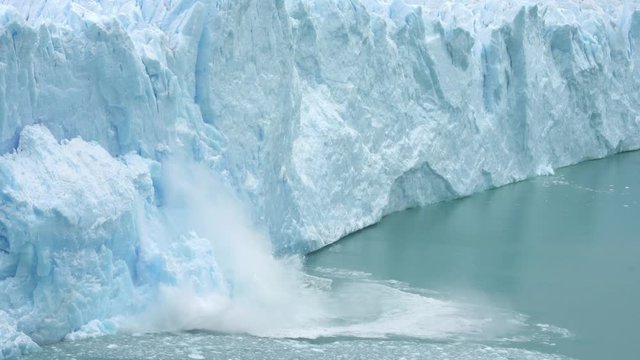 Ice Collapse From Glacier Into Lake. Climate Change and Global Warming Concept