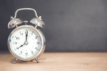 clock on the wooden desk