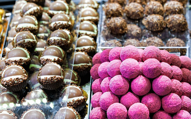 Selection of milk Swiss chocolate truffles. Mixed media.