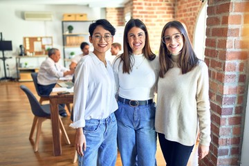 Beautiful businesswomen smiling happy. Standing with smile on face speaking taking rest at the office