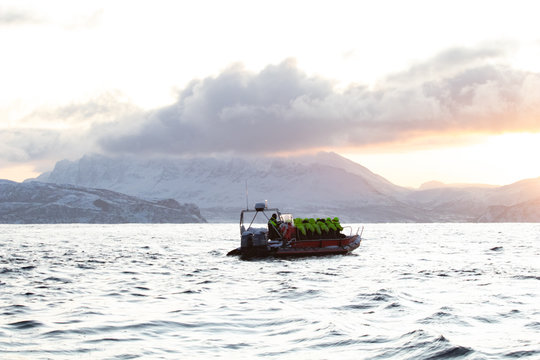 rib boat in the Arctic polar sea for excursions and whale and cetacean observation. Whale watching in the arctic in northern europe. Zodiac inflatable boat on the North Sea