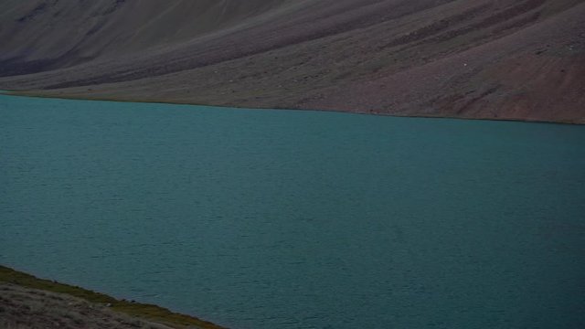 The pristine crystal clear himalayan lake , chandratal lake , spiti valley