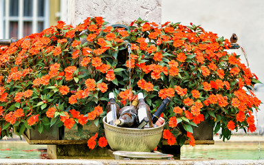 Fountain and blooming flowers in Kramgasse street in Bern, Switzerland. Mixed media.