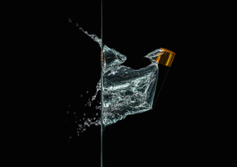The vial of perfume in a splash in the water