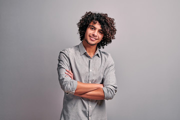 Young modern arabian student in casual clothes with crossed hands