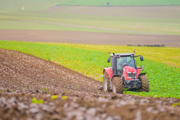 farmer plowing his fields in early spring