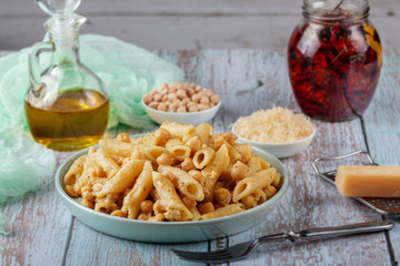Italian pasta with chickpeas, spices and tomatoes - closeup