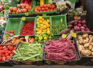Santa Cruz de la Palma, La Palma, Canary Islands, Spain, December 23, 2019: fruit and vegetable stand in market hall with colorful boxes full of tropical fruit © Kristyna