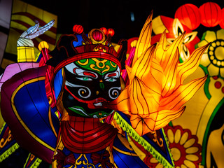 A Mythic Chinese Figure Breathing Fire In The Form Of A Chinese Lantern