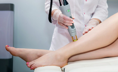 Laser hair removal. Laser procedure in a cosmetology clinic
