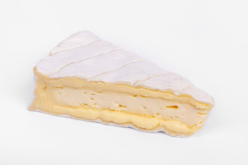french cow's milk cheese called Brie de Normandie isolated on white background