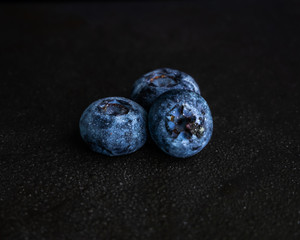 Blueberry on the black background. Healthy raw food