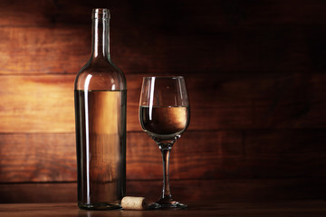 bottle of white wine with a goblet