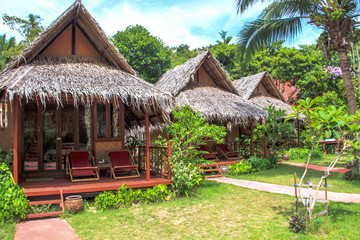 Fototapeta na wymiar vacation holidays in thailand on the beach in a bungalow and under a palm tree
