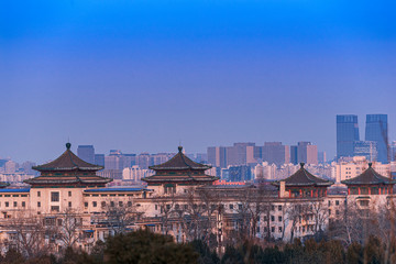 Fototapeta na wymiar Beijing cityscape between ancient chinese architecture. historic buildings and Beijing modern building with blue sky, Beijing, China