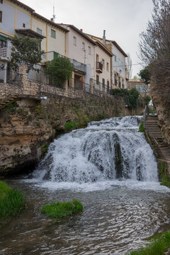 Cifuentes river waterfall when it passes through the center of Trillo, Guadalajara, Spain © LourdesConvertida