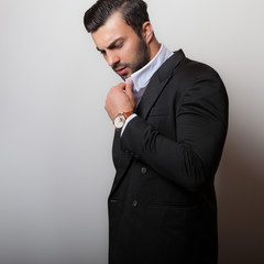 Handsome young elegant man studio portrait.