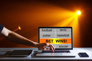 Euphoric winner happy man using a laptop in a desk at home