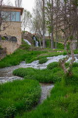 Cifuentes river waterfall when it passes through the center of Trillo, Guadalajara, Spain