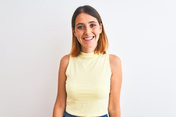 Beautiful redhead woman wearing yellow summer t-shirt over isolated background with a happy and cool smile on face. Lucky person.