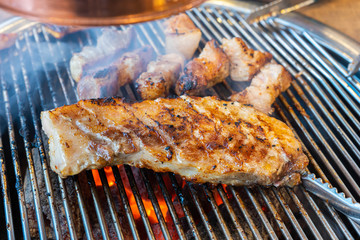 A Cuts of big meat barbecue, grilled with smoke  buffet in the restaurant.