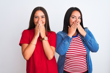 Young beautiful women wearing casual clothes standing over isolated white background laughing and...