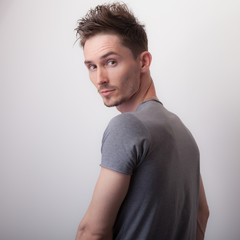 Handsome young elegant man studio portrait.