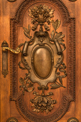 Luxuriously decorated old wooden door