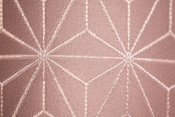 fabric texture with ornament in the form of a snowflake or spider.