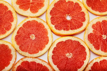 Background formed with sliced grapefruits	