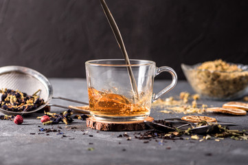 A Cup of freshly brewed black tea on dark background