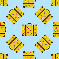Seamless pattern with retro suitcase. Vintage baggage with stickers,flags and labels.