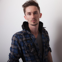 Handsome young elegant man studio portrait.