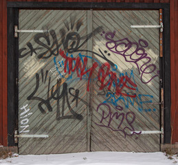grafitti on large wooden door