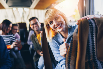 Happy passengers traveling by bus. - obrazy, fototapety, plakaty