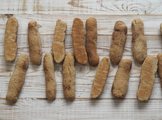 Homemade shortbread biscuits with cinnamon and nuts on a white wooden table. We bake cookies.