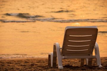 Beautiful view of the beach during sunset, beach chair with beautiful sea background