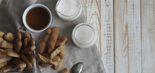 Homemade shortbread biscuits with cinnamon and nuts on a white wooden table. We bake cookies.